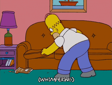 gif homer simpson looking under couch cushions looking for something